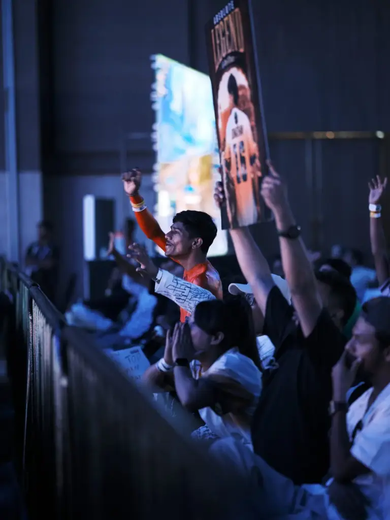 Fans cheer their teams from the barricade. (Image via KRAFTON India)
