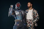 Voice actor Ben Starr, known for Final Fantasy 16 and Hades 2, has been confirmed as the voice of The Visitor in Fortnite. The Seven are set to return on February 23, 2026, as part of the Love and Legends roadmap.