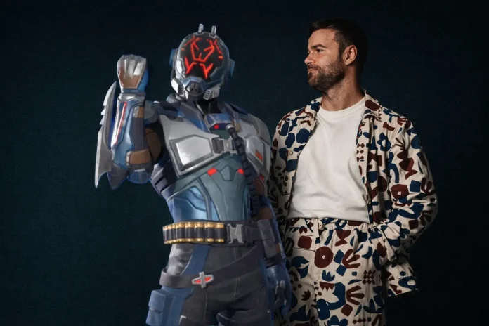 Voice actor Ben Starr, known for Final Fantasy 16 and Hades 2, has been confirmed as the voice of The Visitor in Fortnite. The Seven are set to return on February 23, 2026, as part of the Love and Legends roadmap.