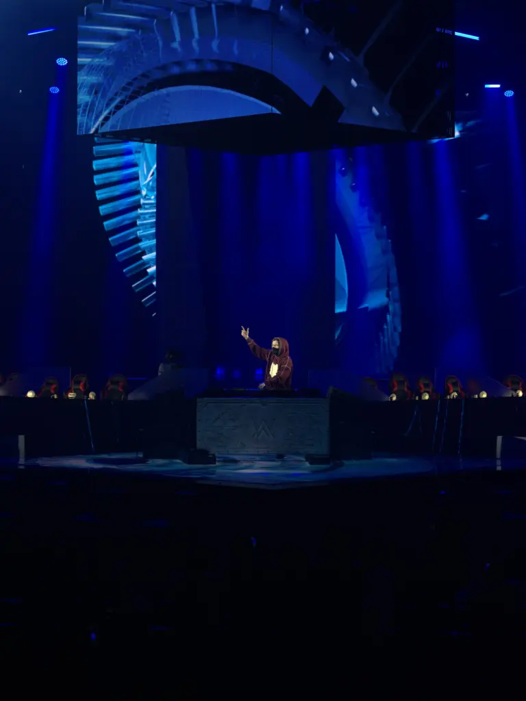 Alan Walker's DJ booth under blue light at BMIC 2026
