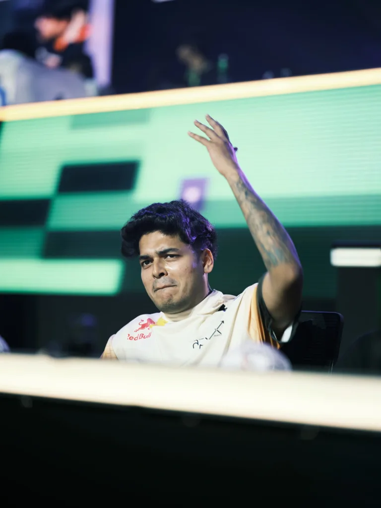 Team Apex Gaming's Jonathan acknowledges the crowd from his seat on Day 1. (Image via KRAFTON India)
