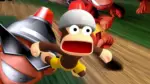 Spike holding a net while chasing a helmet-wearing monkey in the original Ape Escape on PS1