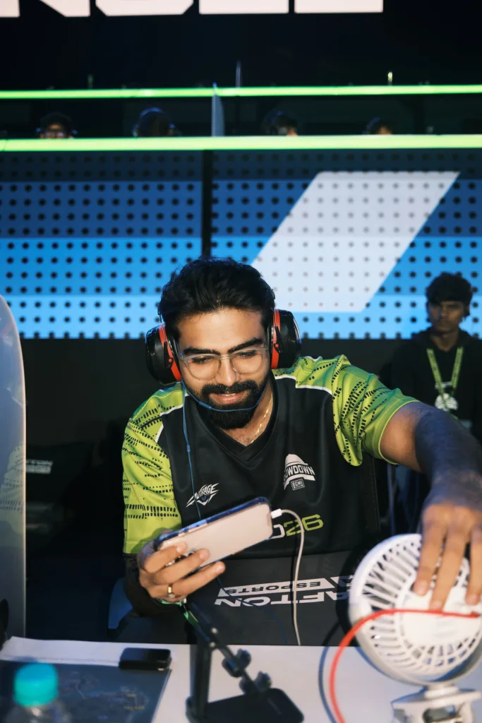 Team Outrage's Omega gets set up at his booth on Day 1. (Image via KRAFTON India)