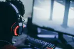 Esports player communicating with teammates over a headset