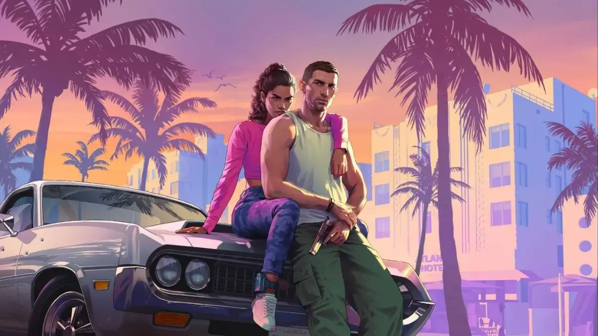 Official GTA 6 key art of Lucia and Jason sitting on the hood of a classic car under palm trees in front of an Art Deco hotel in Vice City.