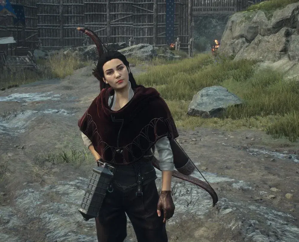 XYAA’s Official Pawn in a red velvet hooded cape holding a bow in Dragon’s Dogma 2: Dark Arisen